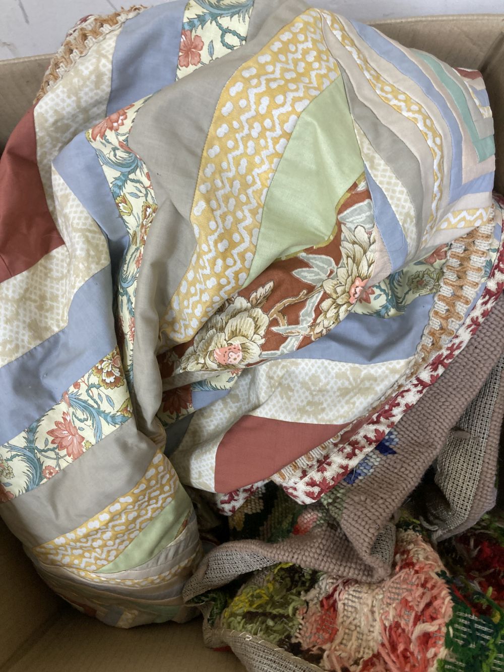 A floral tapestry apron piece, together with a further patchwork cover (2)